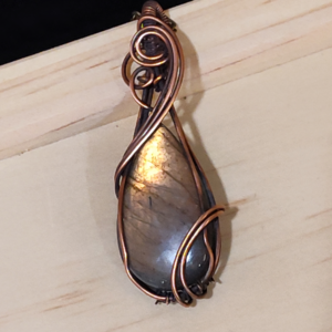 pink and gold double curve pendant